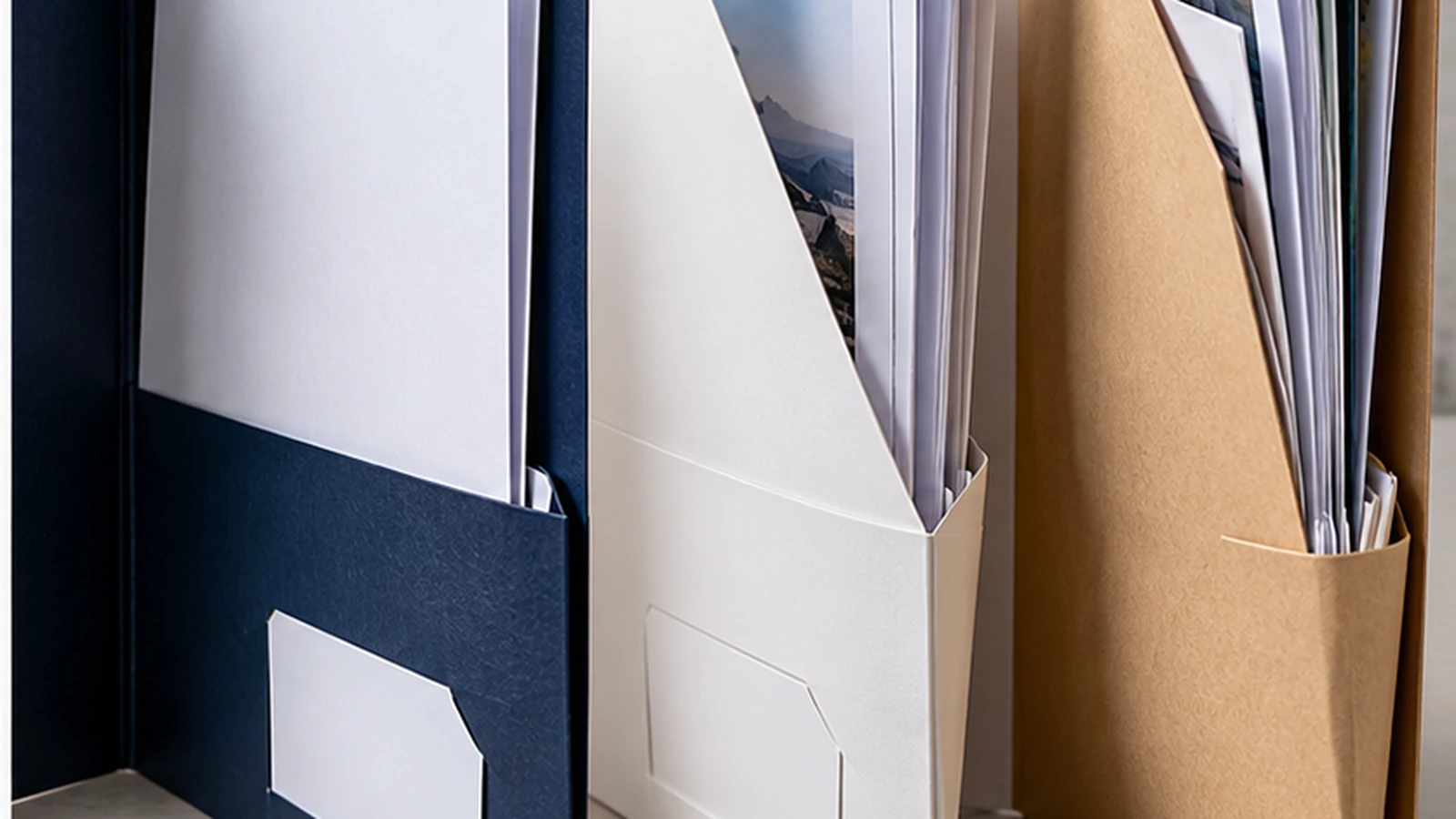 Open presentation folders showing different pocket depths and document capacities
